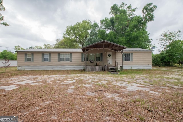 657 Reynolds Rd, Folkston, GA 31537 - manufactured / mobile home with a porch and metal roof