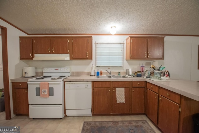 657 Reynolds Rd, Folkston, GA 31537 - kitchen featuring white appliances, light countertops, a textured ceiling, under cabinet range hood, and a sink