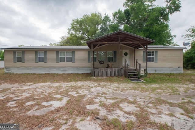 657 Reynolds Rd, Folkston, GA 31537 - manufactured / mobile home featuring covered porch and metal roof