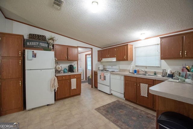 657 Reynolds Rd, Folkston, GA 31537 - kitchen featuring visible vents, lofted ceiling, white appliances, under cabinet range hood, and a sink