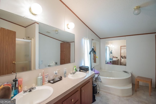 657 Reynolds Rd, Folkston, GA 31537 - full bathroom with a sink, a bath, a stall shower, and vaulted ceiling