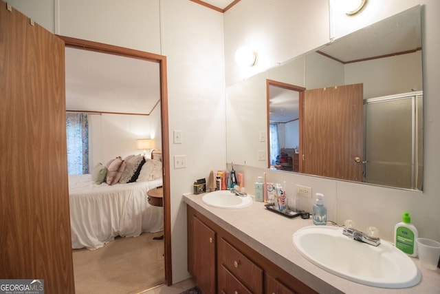 657 Reynolds Rd, Folkston, GA 31537 - ensuite bathroom with double vanity, a sink, a shower with door, and ensuite bath