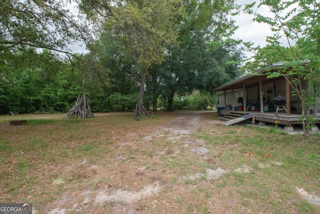 657 Reynolds Rd, Folkston, GA 31537 - view of yard with a wooden deck