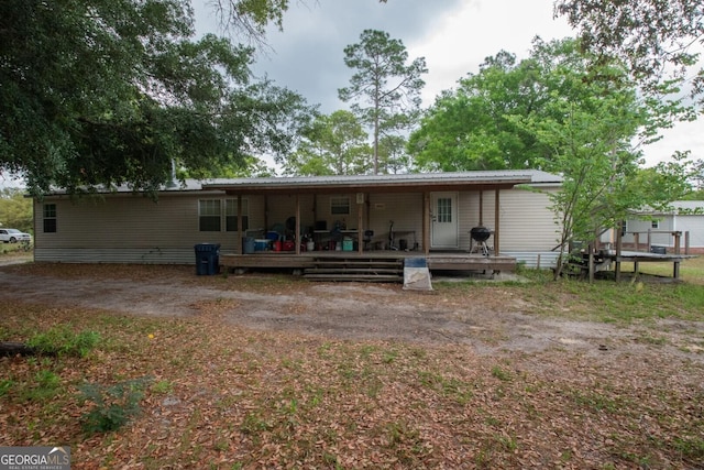 657 Reynolds Rd, Folkston, GA 31537 - rear view of house featuring a wooden deck