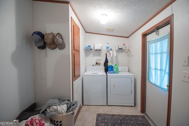 657 Reynolds Rd, Folkston, GA 31537 - laundry area featuring separate washer and dryer, laundry area, and a textured ceiling