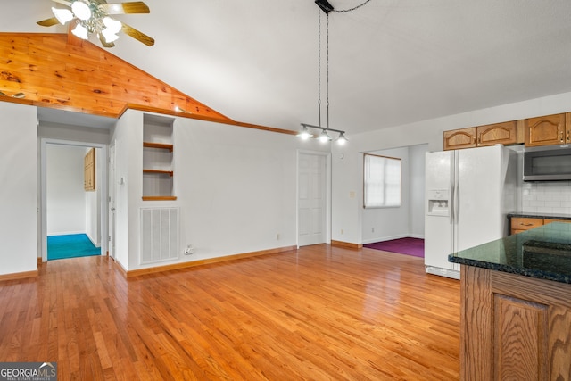 2421 Settlers Ridge Rd, Hiawassee, GA 30546 - unfurnished living room featuring ceiling fan, light wood finished floors, and vaulted ceiling