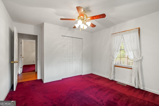 2421 Settlers Ridge Rd, Hiawassee, GA 30546 - unfurnished bedroom featuring carpet flooring, a closet, and ceiling fan