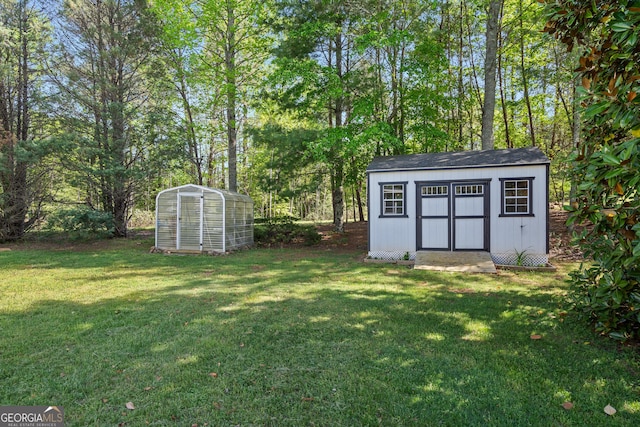 2421 Settlers Ridge Rd, Hiawassee, GA 30546 - view of grassy yard featuring a storage unit