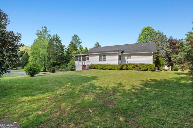 2421 Settlers Ridge Rd, Hiawassee, GA 30546 - back of property featuring a lawn and a sunroom