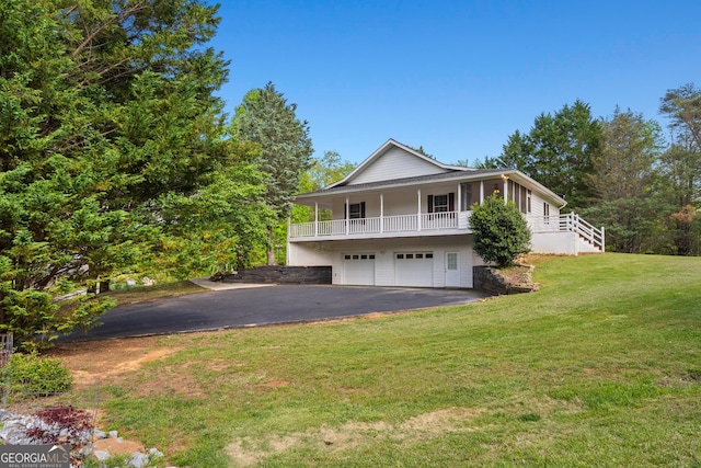 2421 Settlers Ridge Rd, Hiawassee, GA 30546 - view of front facade featuring asphalt driveway, an attached garage, a front lawn, and stairs