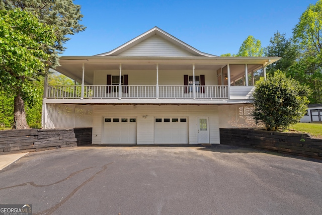 2421 Settlers Ridge Rd, Hiawassee, GA 30546 - view of front facade featuring asphalt driveway and an attached garage