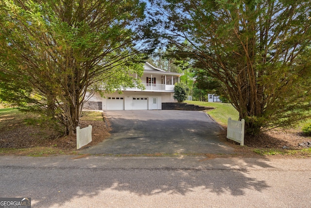 2421 Settlers Ridge Rd, Hiawassee, GA 30546 - view of front of house featuring asphalt driveway and an attached garage