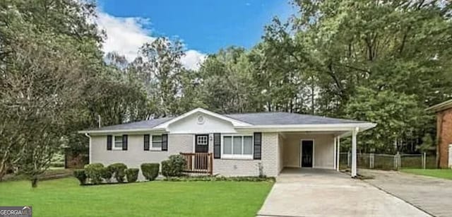 6507 Jackie Ln, Austell, GA 30106 - single story home with a front lawn, fence, driveway, and a carport