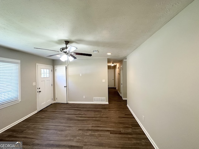 6507 Jackie Ln, Austell, GA 30106 - interior space featuring ceiling fan, a textured ceiling, visible vents, baseboards, and dark wood-type flooring