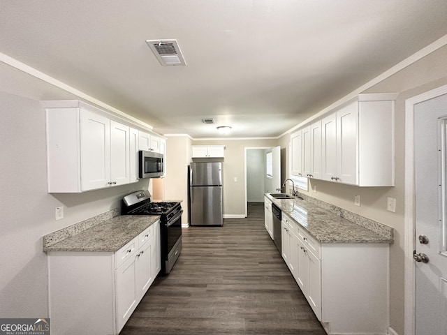 6507 Jackie Ln, Austell, GA 30106 - kitchen with visible vents, a sink, white cabinets, and stainless steel appliances