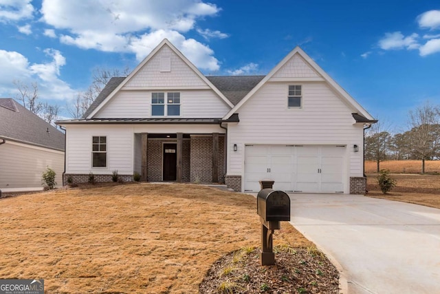 view of front facade with brick siding, a garage, driveway, and a standing seam roof