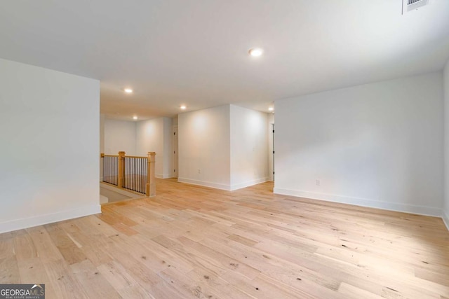 interior space with light wood-style floors, baseboards, recessed lighting, and visible vents