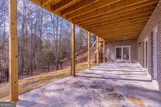 view of patio / terrace with stairway and a fenced backyard