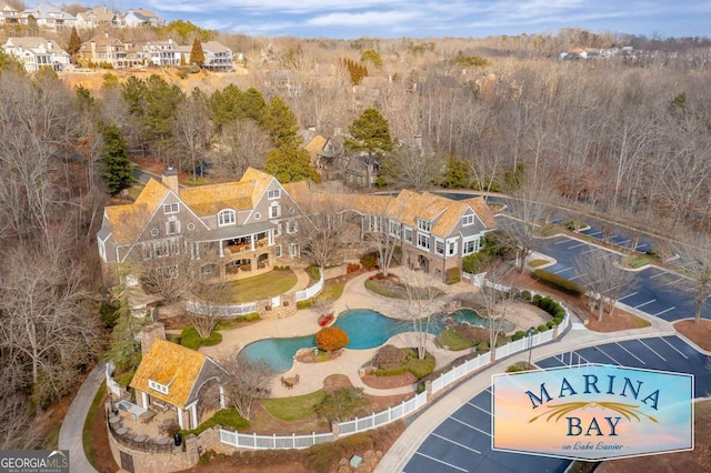 bird's eye view featuring a wooded view