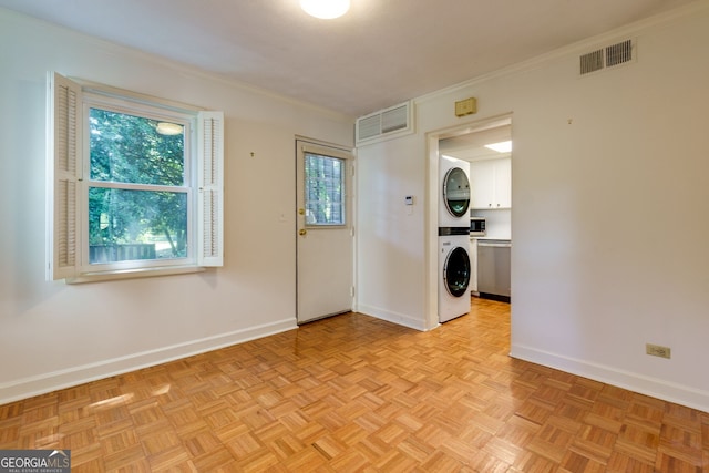 301 Lakemoore Dr NE Unit B, Atlanta, GA 30342 - interior space featuring visible vents, stacked washer and dryer, cabinet space, and baseboards