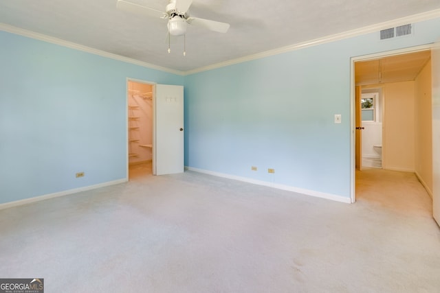 301 Lakemoore Dr NE Unit B, Atlanta, GA 30342 - unfurnished bedroom with baseboards, visible vents, ornamental molding, and carpet
