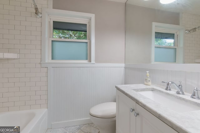 301 Lakemoore Dr NE Unit B, Atlanta, GA 30342 - full bath featuring vanity, shower / bathing tub combination, a wainscoted wall, and toilet