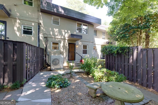 301 Lakemoore Dr NE Unit B, Atlanta, GA 30342 - view of front of home featuring fence private yard, ac unit, and stucco siding