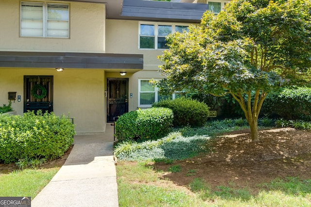 301 Lakemoore Dr NE Unit B, Atlanta, GA 30342 - doorway to property with stucco siding