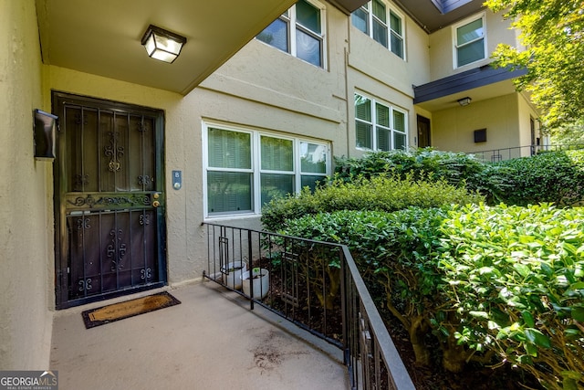 301 Lakemoore Dr NE Unit B, Atlanta, GA 30342 - view of exterior entry featuring stucco siding