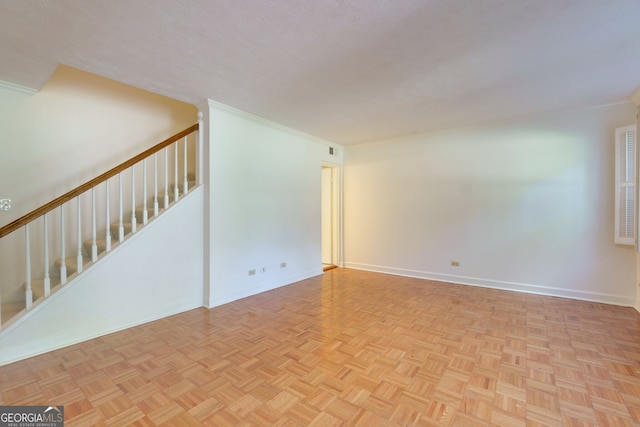 301 Lakemoore Dr NE Unit B, Atlanta, GA 30342 - unfurnished living room featuring stairway, baseboards, crown molding, and visible vents