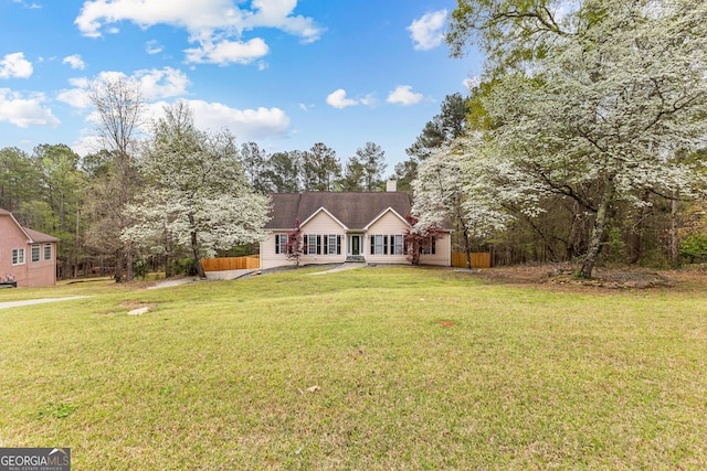 195 Blackberry Run, Fayetteville, GA 30214 - view of front of house featuring a chimney, fence, and a front yard