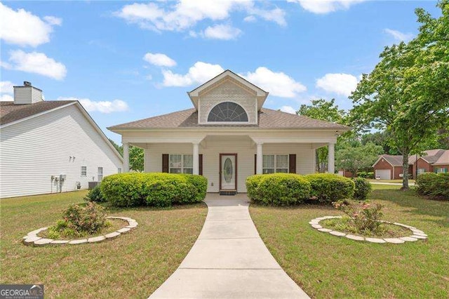 310 Autumn Glen Cir, Fayetteville, GA 30215 - view of front facade with a porch and a front yard