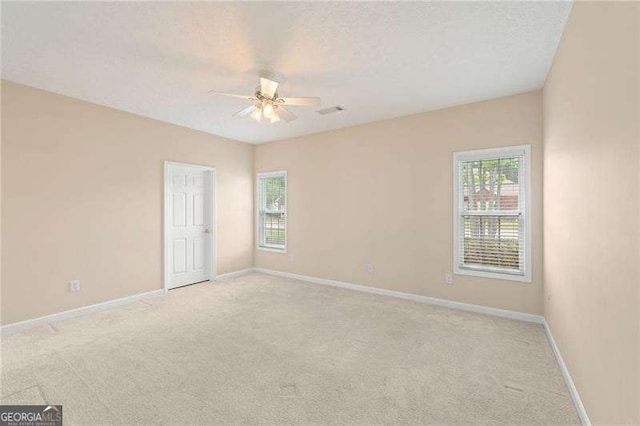 310 Autumn Glen Cir, Fayetteville, GA 30215 - empty room featuring light colored carpet, baseboards, ceiling fan, and visible vents