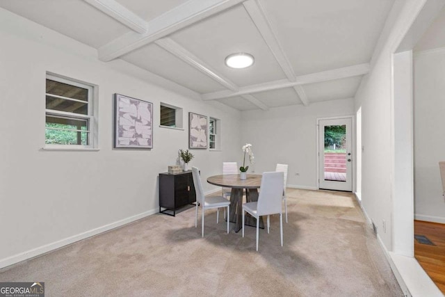 carpeted dining area featuring baseboards, beam ceiling, and coffered ceiling