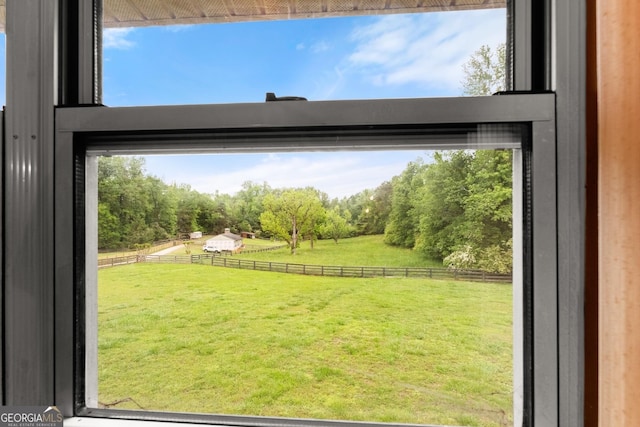 doorway to outside with a rural view