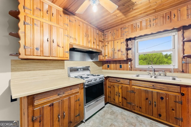 kitchen with brown cabinetry, white range with gas cooktop, under cabinet range hood, wooden ceiling, and a sink