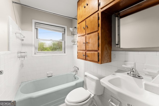 full bath featuring a sink, toilet, tile walls, decorative backsplash, and tub / shower combination