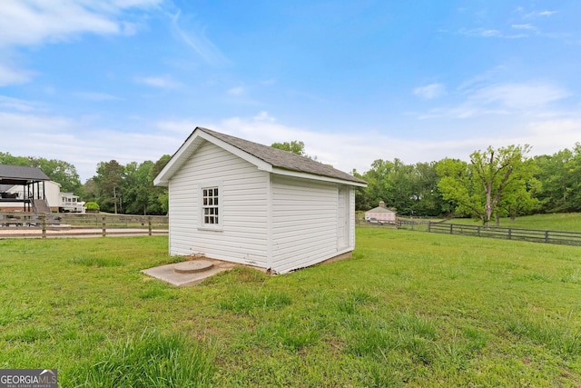 view of shed with fence