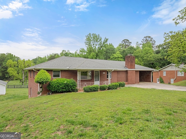 ranch-style house with a porch, driveway, a chimney, brick siding, and fence