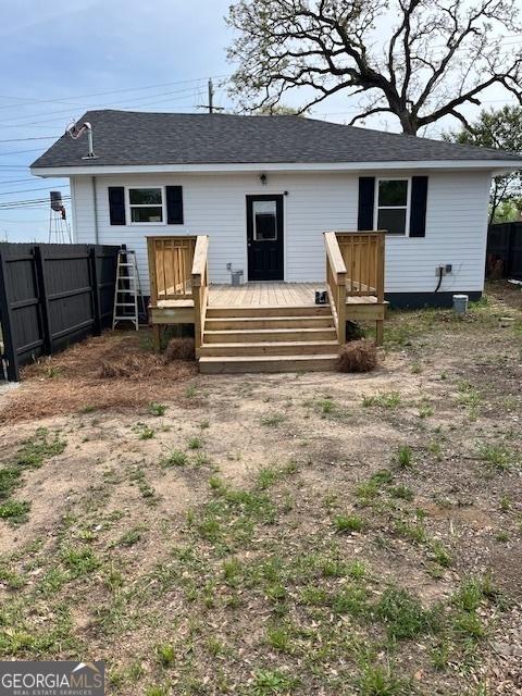 1823 Wrightsboro Rd, Augusta, GA 30904 - back of property with fence, a wooden deck, and a shingled roof