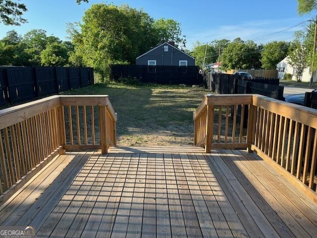 1823 Wrightsboro Rd, Augusta, GA 30904 - wooden deck featuring a fenced backyard and a yard