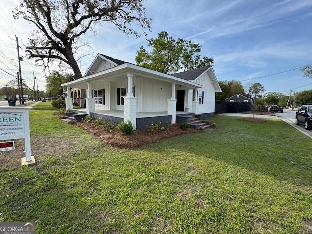 1823 Wrightsboro Rd, Augusta, GA 30904 - view of property exterior featuring covered porch, board and batten siding, and a yard