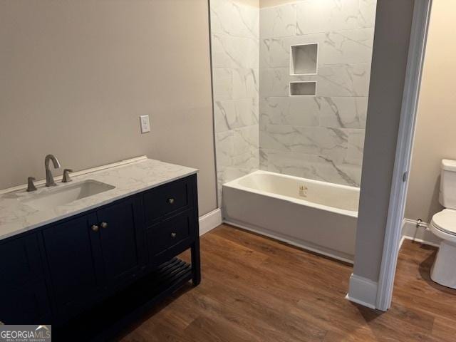 1823 Wrightsboro Rd, Augusta, GA 30904 - bathroom featuring vanity, baseboards, toilet, and wood finished floors