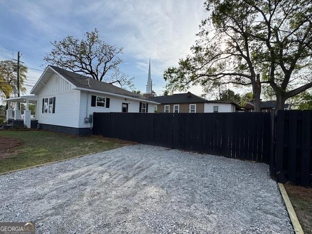 1823 Wrightsboro Rd, Augusta, GA 30904 - rear view of property featuring board and batten siding and fence
