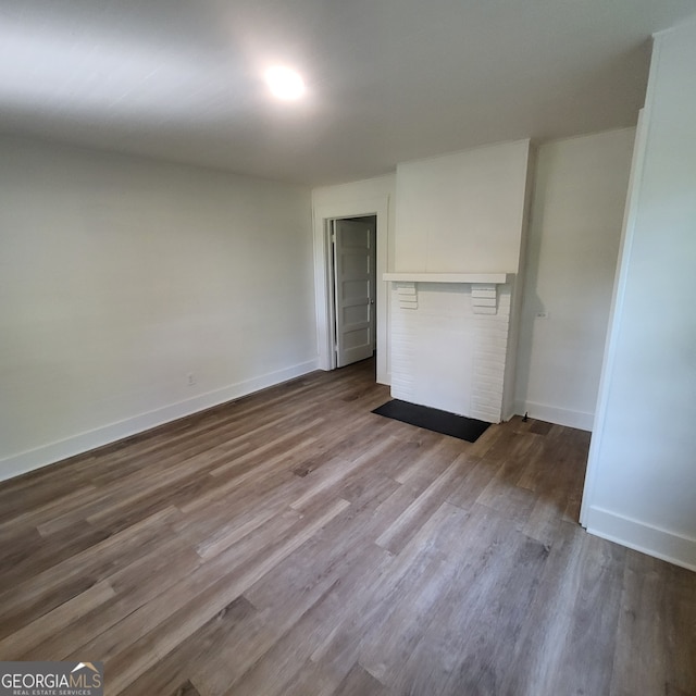 unfurnished bedroom featuring baseboards and wood finished floors
