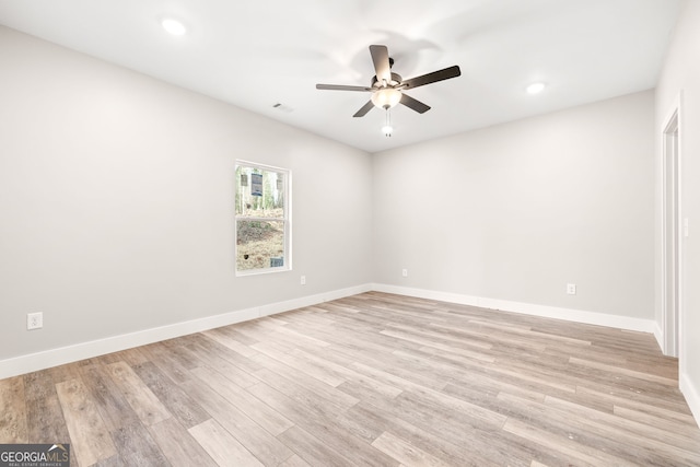 spare room with a ceiling fan, visible vents, baseboards, light wood finished floors, and recessed lighting
