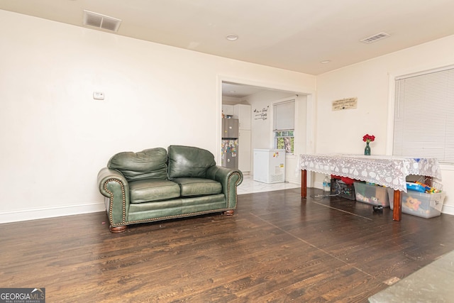 2576 Flat Shoals Rd, Decatur, GA 30034 - living area featuring baseboards, visible vents, and wood finished floors