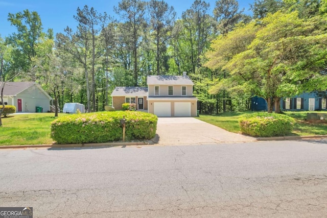 5379 Winslow Xing, Lithonia, GA 30038 - view of front of house with a garage, a front yard, and concrete driveway