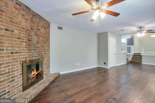 5379 Winslow Xing, Lithonia, GA 30038 - unfurnished living room featuring stairs, a ceiling fan, visible vents, and wood finished floors