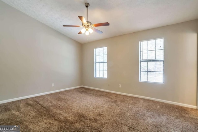5379 Winslow Xing, Lithonia, GA 30038 - unfurnished room featuring baseboards, a ceiling fan, carpet, and lofted ceiling
